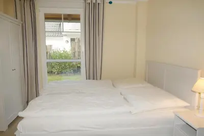 Ein Bett oder Betten in einem Zimmer der Unterkunft Ibykus