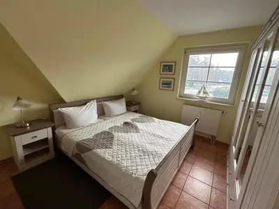 Ein Bett oder Betten in einem Zimmer der Unterkunft K&S Ferienwohnungen