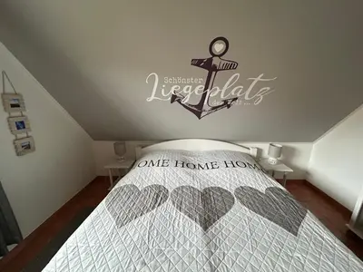 Ein Bett oder Betten in einem Zimmer der Unterkunft K&S Ferienwohnungen