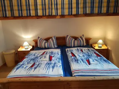 Ein Bett oder Betten in einem Zimmer der Unterkunft Haus Weidenhof App 1