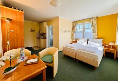 Ein Bett oder Betten in einem Zimmer der Unterkunft Hotel Gode Tied