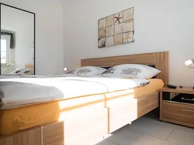 Ein Bett oder Betten in einem Zimmer der Unterkunft Pirol FW 8, PP von Klosterstr