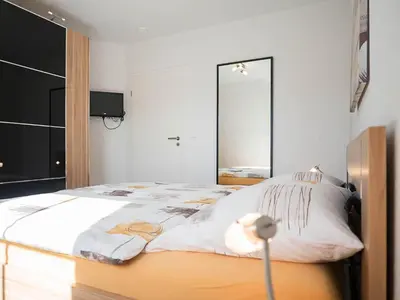 Ein Bett oder Betten in einem Zimmer der Unterkunft Pirol FW 8, PP von Klosterstr