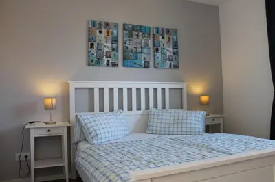 Ein Bett oder Betten in einem Zimmer der Unterkunft Ferienwohnung Blue in Born