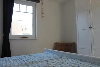 Ein Bett oder Betten in einem Zimmer der Unterkunft Ferienwohnung Blue in Born