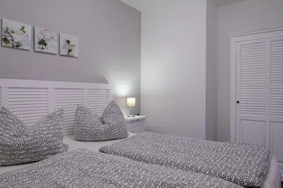 Ein Bett oder Betten in einem Zimmer der Unterkunft Ferienwohnung Blue in Born