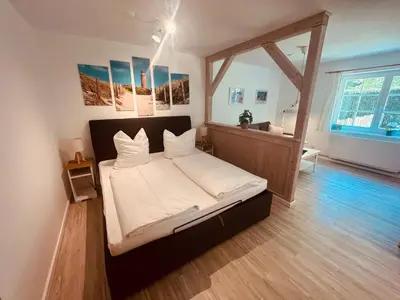 Ein Bett oder Betten in einem Zimmer der Unterkunft Ferienwohnung Kimi in Wieck