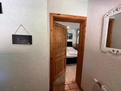 Ein Bett oder Betten in einem Zimmer der Unterkunft Ferienwohnung Kimi in Wieck