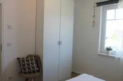 Ein Bett oder Betten in einem Zimmer der Unterkunft Ferienwohnung F 86 in Born