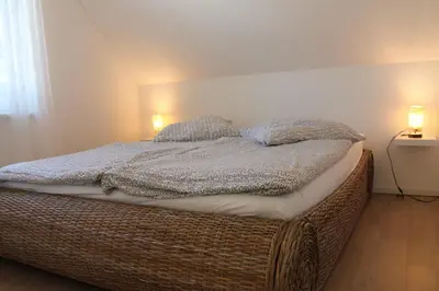 Ein Bett oder Betten in einem Zimmer der Unterkunft Ferienwohnung F 86 in Born