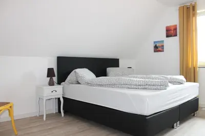 Ein Bett oder Betten in einem Zimmer der Unterkunft Ferienhaus Svea in Born