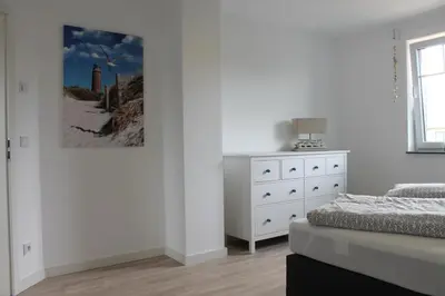 Ein Bett oder Betten in einem Zimmer der Unterkunft Ferienhaus Svea in Born