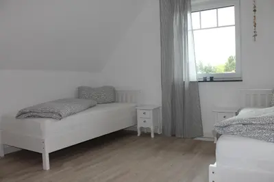 Ein Bett oder Betten in einem Zimmer der Unterkunft Ferienhaus Svea in Born