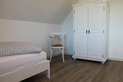 Ein Bett oder Betten in einem Zimmer der Unterkunft Ferienhaus Finja in Born