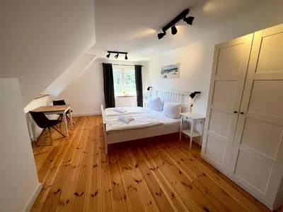 Ein Bett oder Betten in einem Zimmer der Unterkunft Ferienhaus Fiete in Wieck