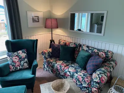 Ein Sitzbereich in der Unterkunft Ferienhaus mit Sauna