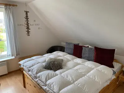 Ein Bett oder Betten in einem Zimmer der Unterkunft Ferienhaus mit Sauna