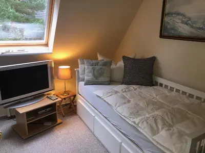 Ein Bett oder Betten in einem Zimmer der Unterkunft romantisches Ferienhaus Boddenblick mit Sauna