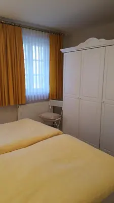 Ein Bett oder Betten in einem Zimmer der Unterkunft Achtern - Diek - am Strand