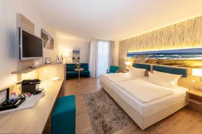 Ein Bett oder Betten in einem Zimmer der Unterkunft Hotel Blinkfüer