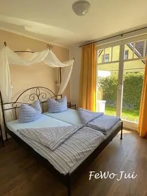 Ein Bett oder Betten in einem Zimmer der Unterkunft Haus Jui