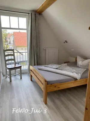 Ein Bett oder Betten in einem Zimmer der Unterkunft Haus Jui