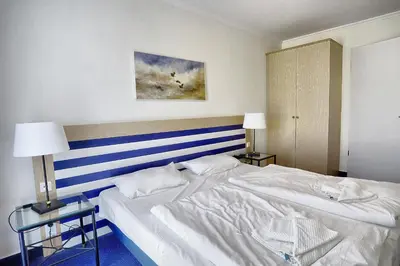 Ein Bett oder Betten in einem Zimmer der Unterkunft Am Kurhaus 211 PP 66