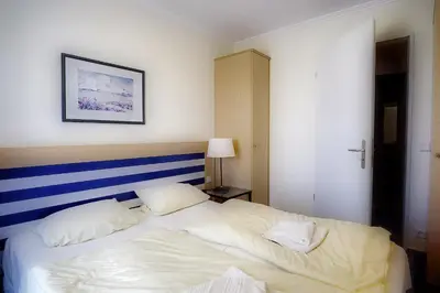 Ein Bett oder Betten in einem Zimmer der Unterkunft Am Kurhaus 318 PP 81