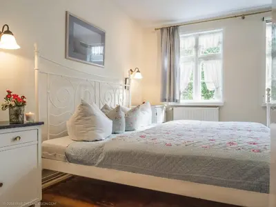 Ein Bett oder Betten in einem Zimmer der Unterkunft altes Kapitänshäuschen