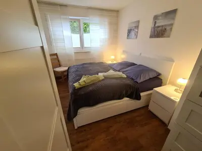 Ein Bett oder Betten in einem Zimmer der Unterkunft Pier 605 - 4 Sterne - 300m Strand Zentrum - POWER WLAN - 2 Parkplätze - early CheckIn - #Bestpreisgarantie#