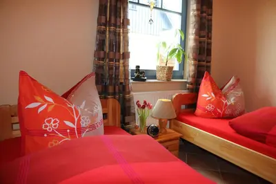 Ein Bett oder Betten in einem Zimmer der Unterkunft Ferienwohnung Baumann