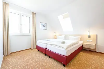 Ein Bett oder Betten in einem Zimmer der Unterkunft BSW-Ferienwohnungen Zingst