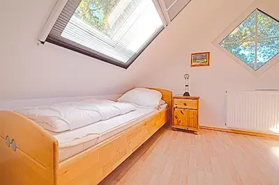 Ein Bett oder Betten in einem Zimmer der Unterkunft Seeadler