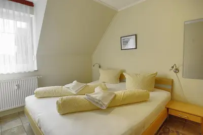 Ein Bett oder Betten in einem Zimmer der Unterkunft Sonne, Whg 4