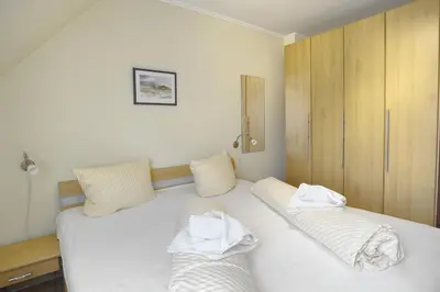 Ein Bett oder Betten in einem Zimmer der Unterkunft Sonne, Whg 4