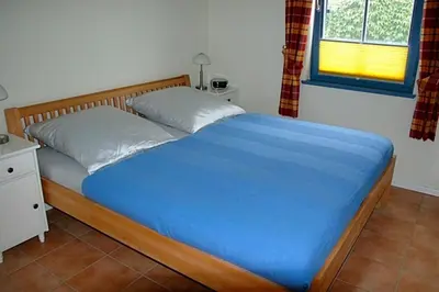 Ein Bett oder Betten in einem Zimmer der Unterkunft Ut Kiek 4