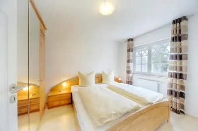 Ein Bett oder Betten in einem Zimmer der Unterkunft Villa Carpe Diem, FW 3
