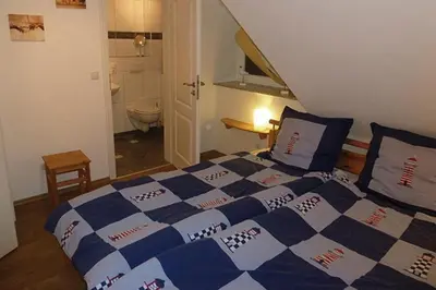 Ein Bett oder Betten in einem Zimmer der Unterkunft Sonnenhus Zingst
