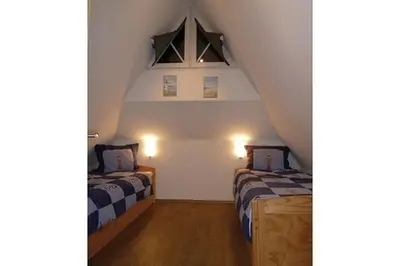 Ein Bett oder Betten in einem Zimmer der Unterkunft Sonnenhus Zingst