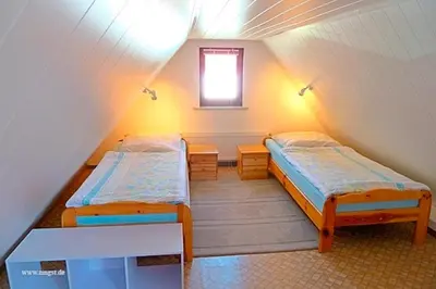 Ein Bett oder Betten in einem Zimmer der Unterkunft Ferienhaus Friedel