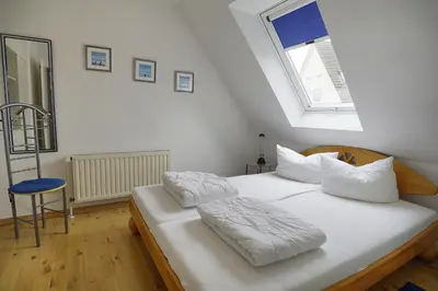 Ein Bett oder Betten in einem Zimmer der Unterkunft Kranich III, Whg 14