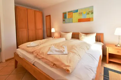 Ein Bett oder Betten in einem Zimmer der Unterkunft Ut kiek, Sprotte