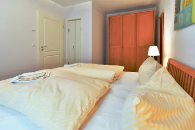 Ein Bett oder Betten in einem Zimmer der Unterkunft Ut kiek, Sprotte