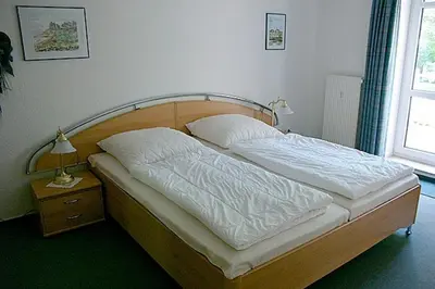 Ein Bett oder Betten in einem Zimmer der Unterkunft Residenz 