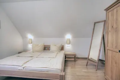 Ein Bett oder Betten in einem Zimmer der Unterkunft Edda