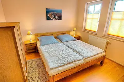 Ein Bett oder Betten in einem Zimmer der Unterkunft Gerlach