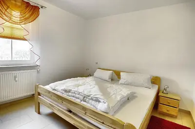 Ein Bett oder Betten in einem Zimmer der Unterkunft Sonnenwinkel, FW 2