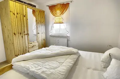Ein Bett oder Betten in einem Zimmer der Unterkunft Sonnenwinkel, FW 2