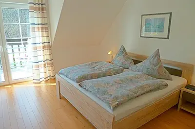 Ein Bett oder Betten in einem Zimmer der Unterkunft Sonnenpalais