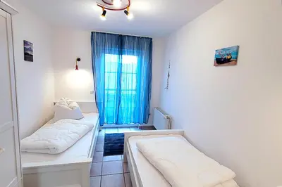 Ein Bett oder Betten in einem Zimmer der Unterkunft Am Strand 2, PP innen